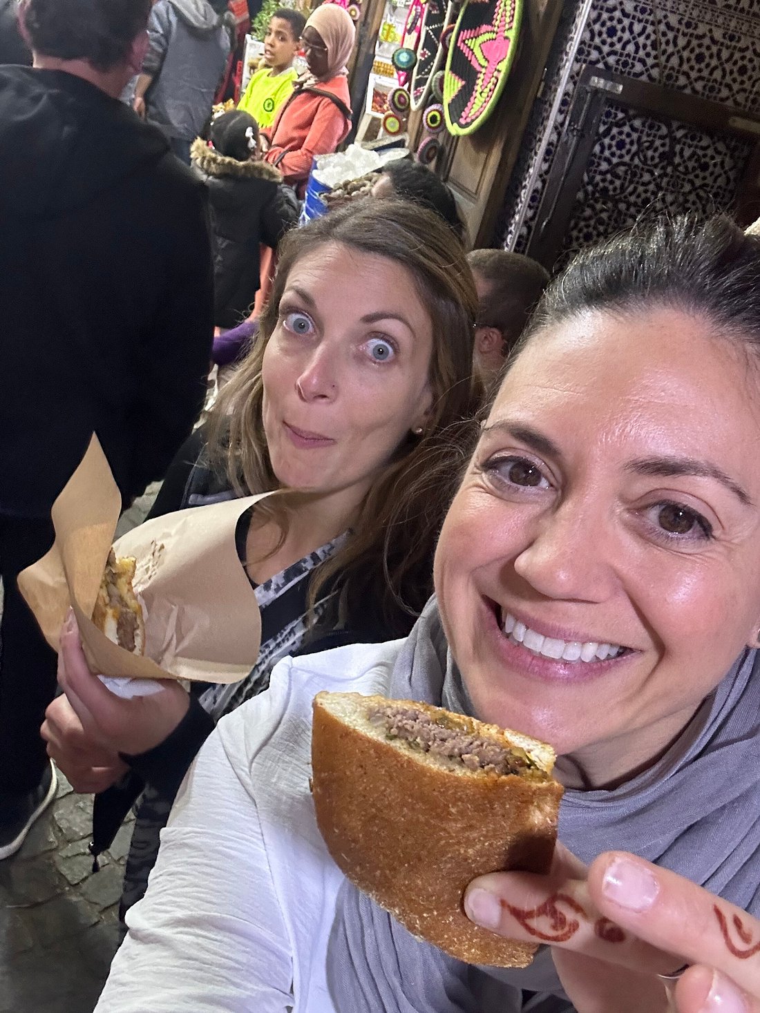 Authentic Marrakech Food Tour - two women enjoying Moroccan street food in Marrakech