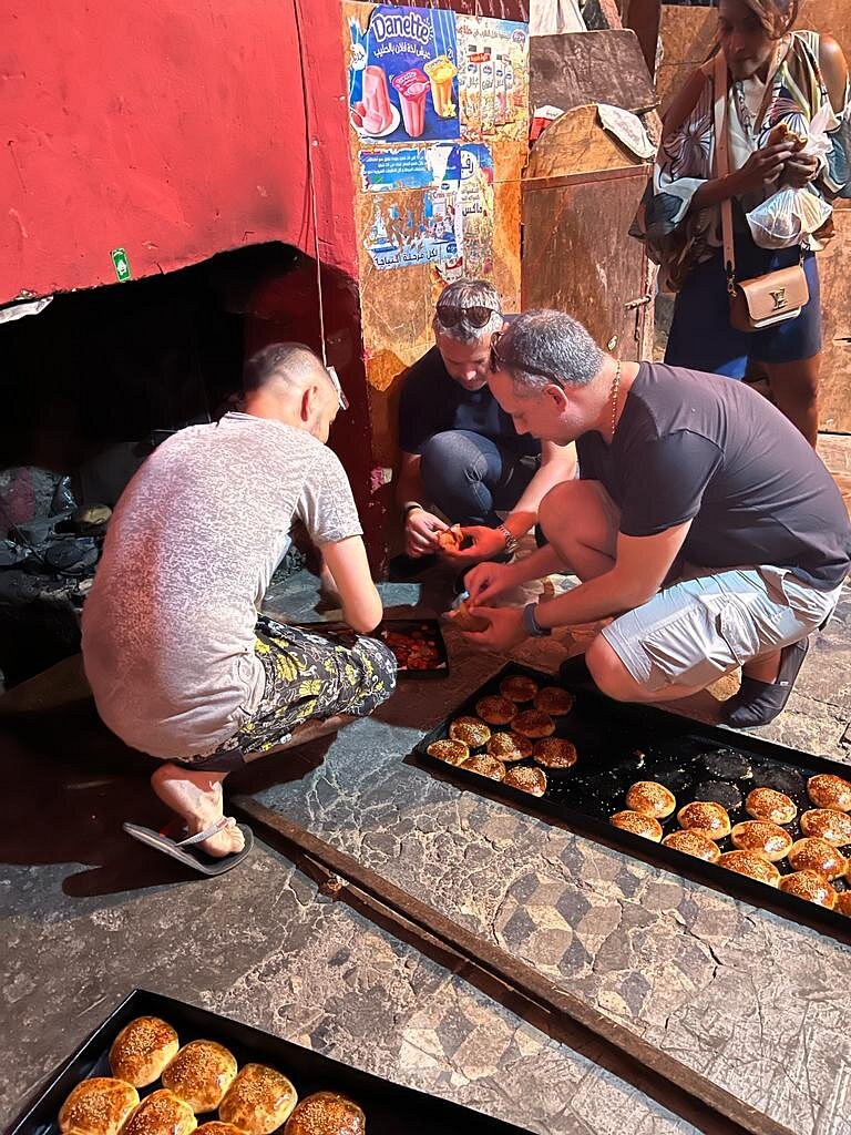 Highlights of Marrakech Marrakech Private City Tour - UGC 3 Authentic Marrakech Food Tour - guest trying snails in Jemaa el Fna square Marrakech