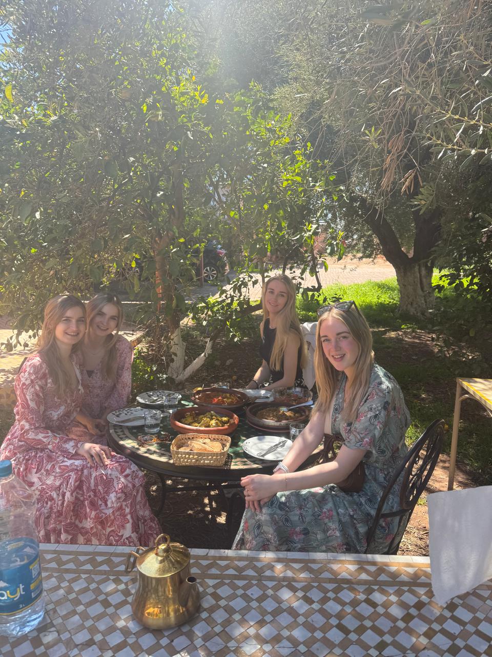 Authentic Marrakech Food Tour - two women enjoying Moroccan panache drink in Marrakech